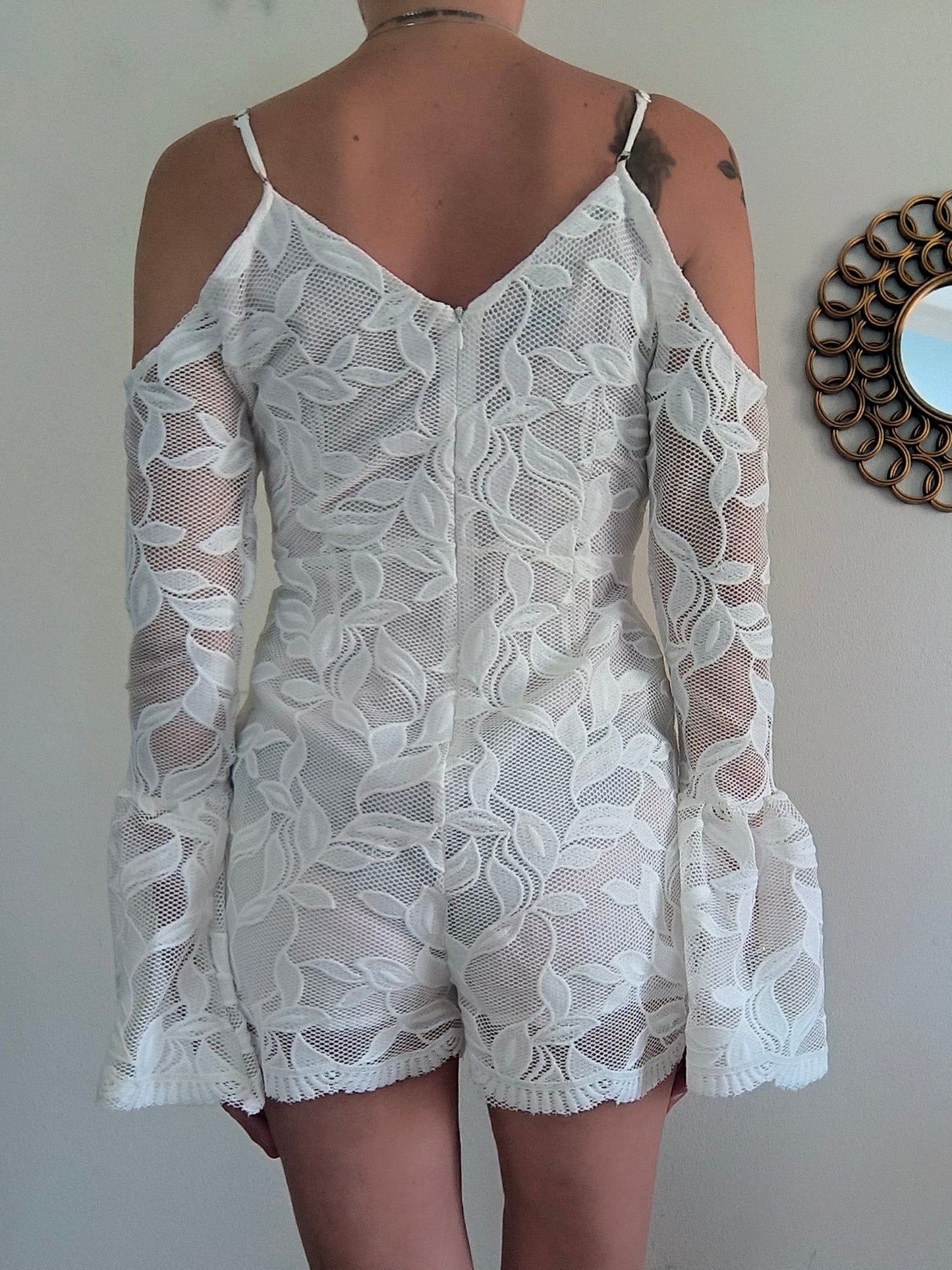 Mini jumpsuit in pizzo bianco